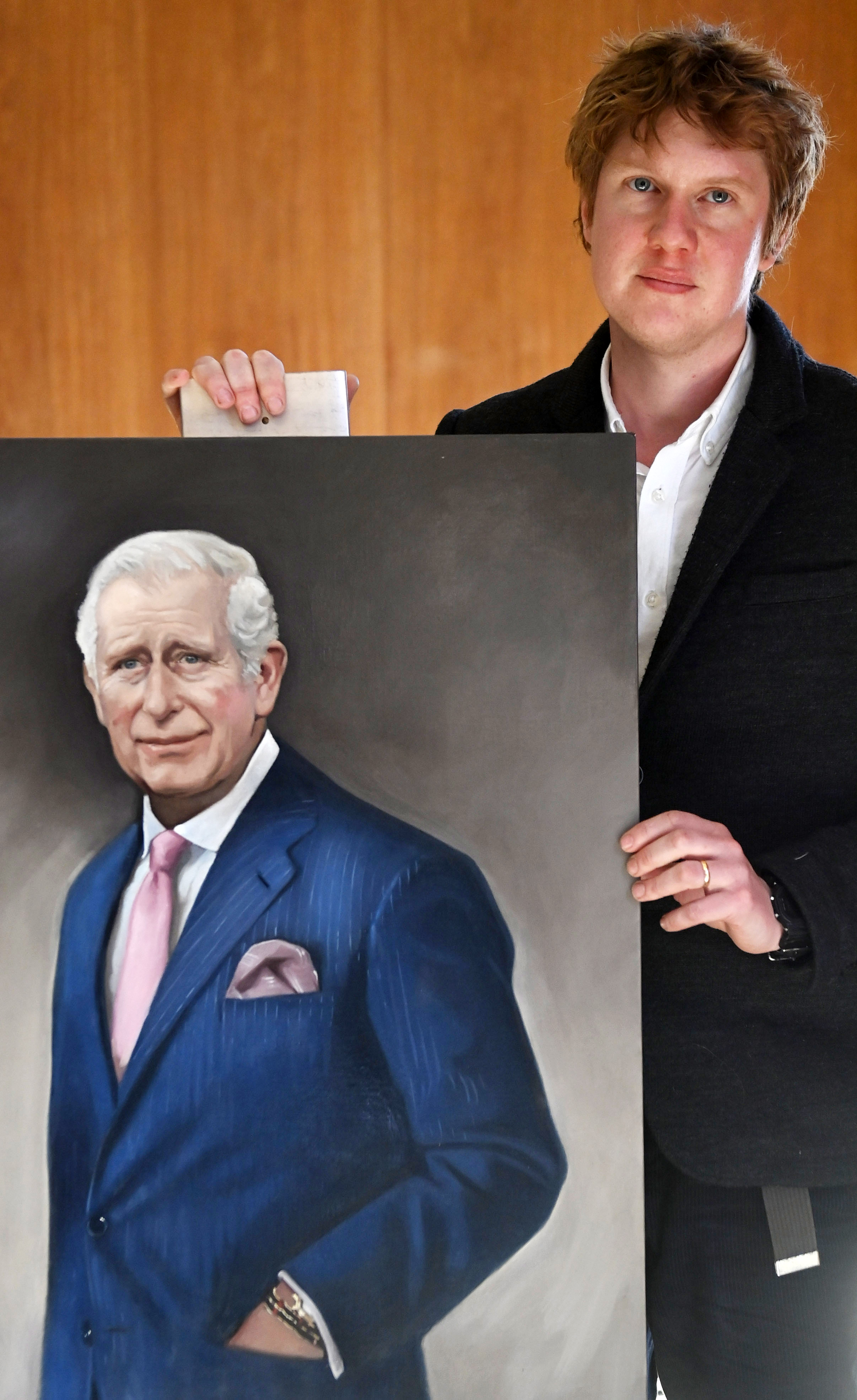 <p>Artist Alastair Barford posed with his work -- an oil painting of King Charles III commissioned by The Illustrated London News corporate magazine -- in London on April 4, 2023. Alastair previously painted the late Queen Elizabeth II.</p>
