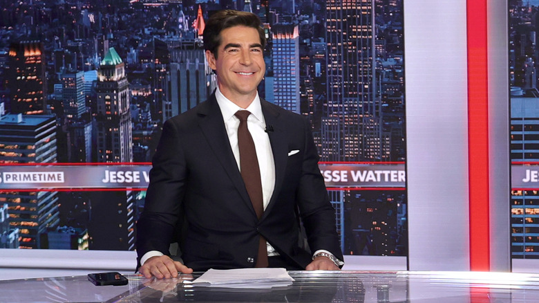 Jesse Watters grinning on the set of "Jesse Watters Primetime."