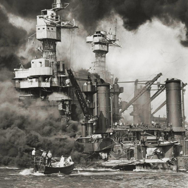 U.S. Navy ships burn following the Japanese surprise attack on Pearl Harbor, Hawaii, on Dec. 7, 1941.