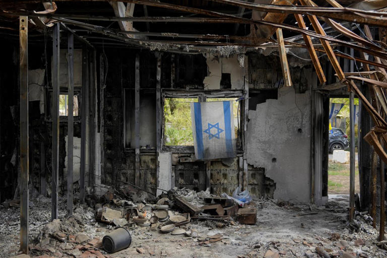 An Israel flag hangs in a house damaged during the Oct. 7, 2023, attacks.