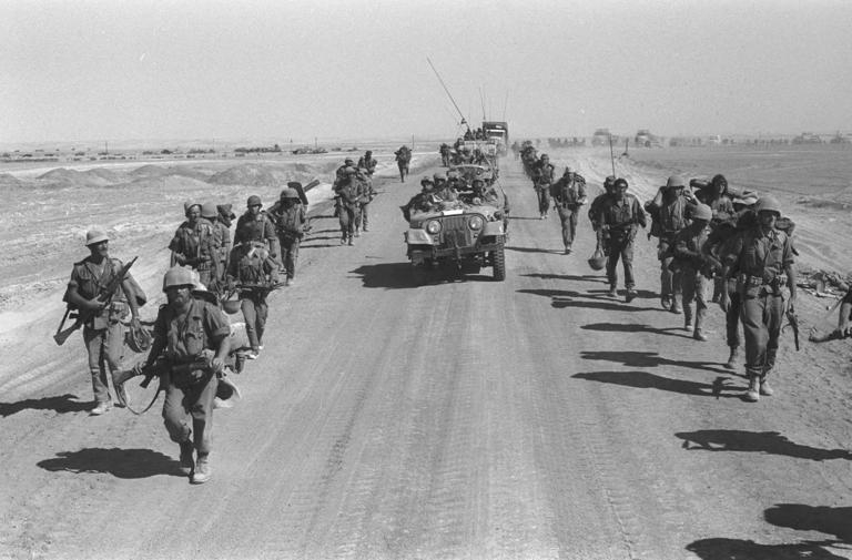 Israeli troops marched on the western bank of the Suez Canal during the 1973 Yom Kippur War.