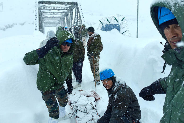 Dozens found alive inside metal containers after they were buried by ...