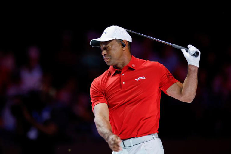 Tiger Woods of Jupiter Links Golf Club reacts to a shot on the seventh hole during their TGL presented by SoFi match against New York Golf Club at SoFi Center on February 18, 2025 in Palm Beach Gardens, Florida