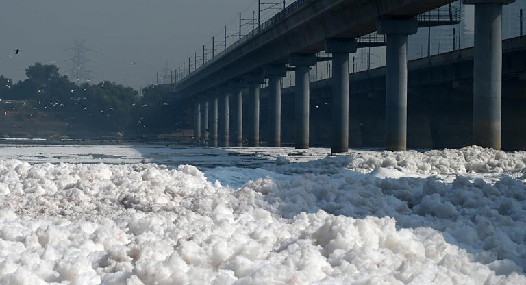 In this photo from Oct. 19, 2024, toxic foam floats on the polluted Yamuna River at Kalindi Kunj, New Delhi.