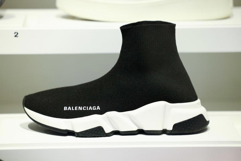 A close-up on a Balenciaga speed trainers sneaker (2017) during the "La Mode En Mouvement #3 – Fashion On the Move #3" Exhibition at Palais Galliera on February 06, 2025 in Paris, France. (Photo by Marc Piasecki/Getty Images)