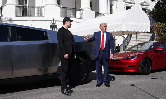 Elon Musk and Donald Trump with Tesla vehicles on the South Lawn driveway of the White House, 11 March 2025 Photograph: REX/Shutterstock