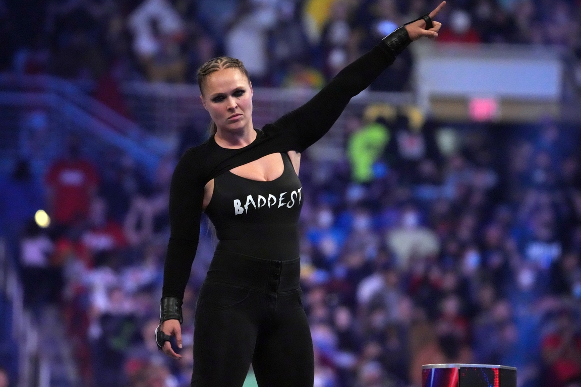 SI Swim model, UFC legend, WWE star Ronda Rousey’s most iconic moments ...