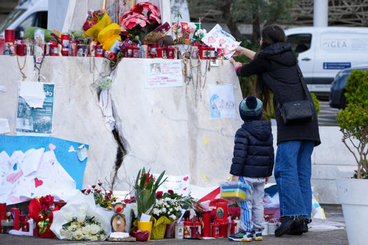 A child and parent outside Gemelli hospital (AP)