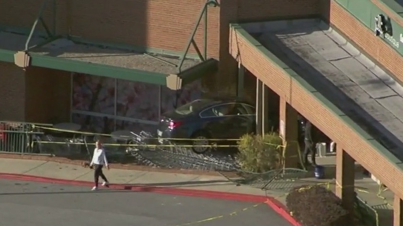Car crashes into Kroger shopping center