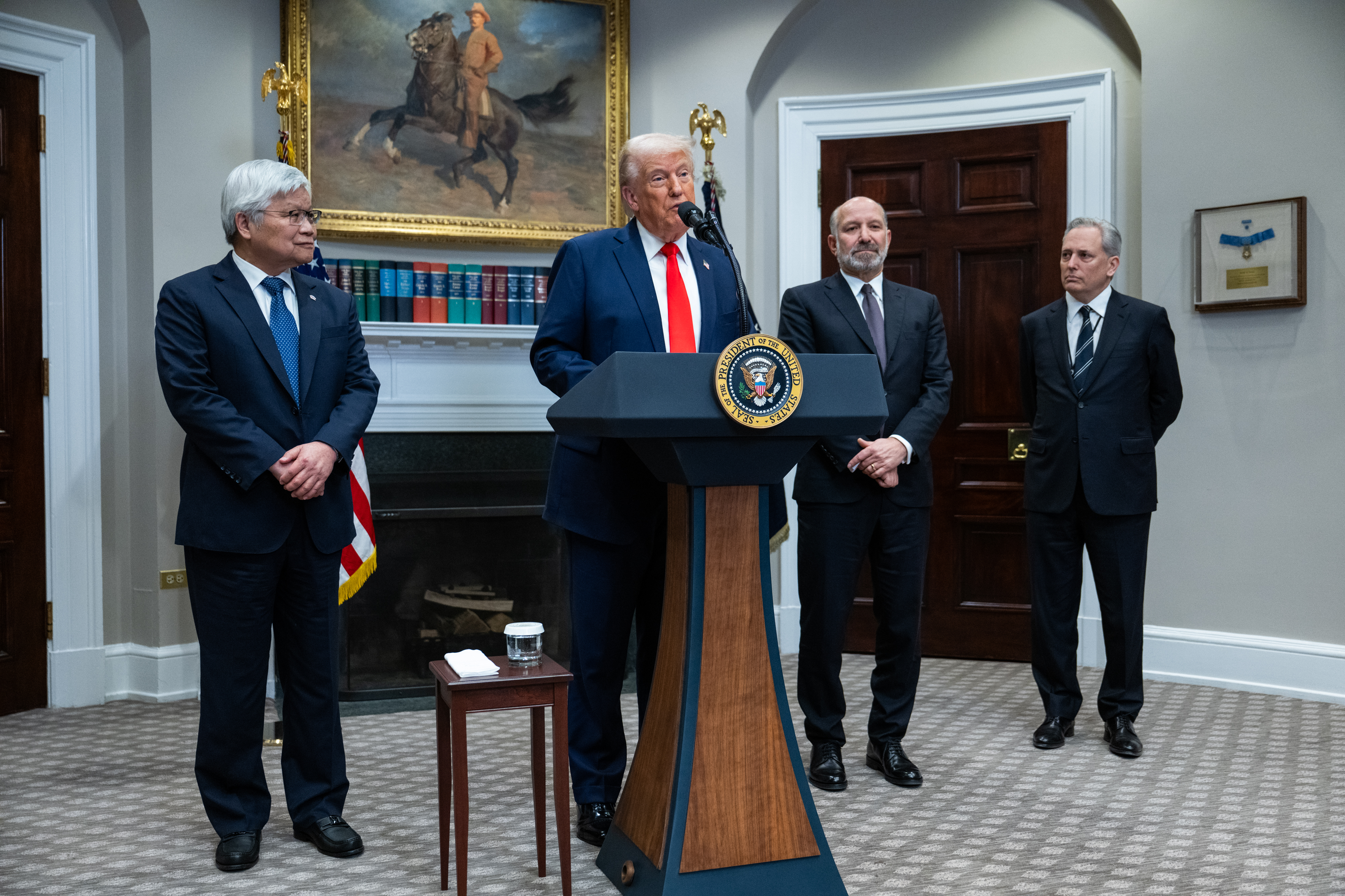 President Donald Trump is joined by Taiwan Semiconductor Manufacturing Company CEO C.C. Wei and Commerce Secretary Howard Lutnick and David Sacks, Trump's AI and crypto czar, during an announcement in the Roosevelt Room of the White House on March 3.