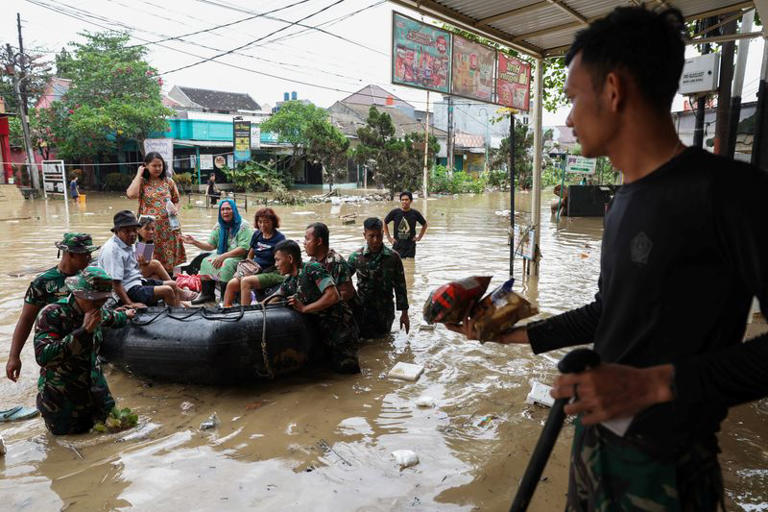 Floods in Indonesia's capital displace thousands