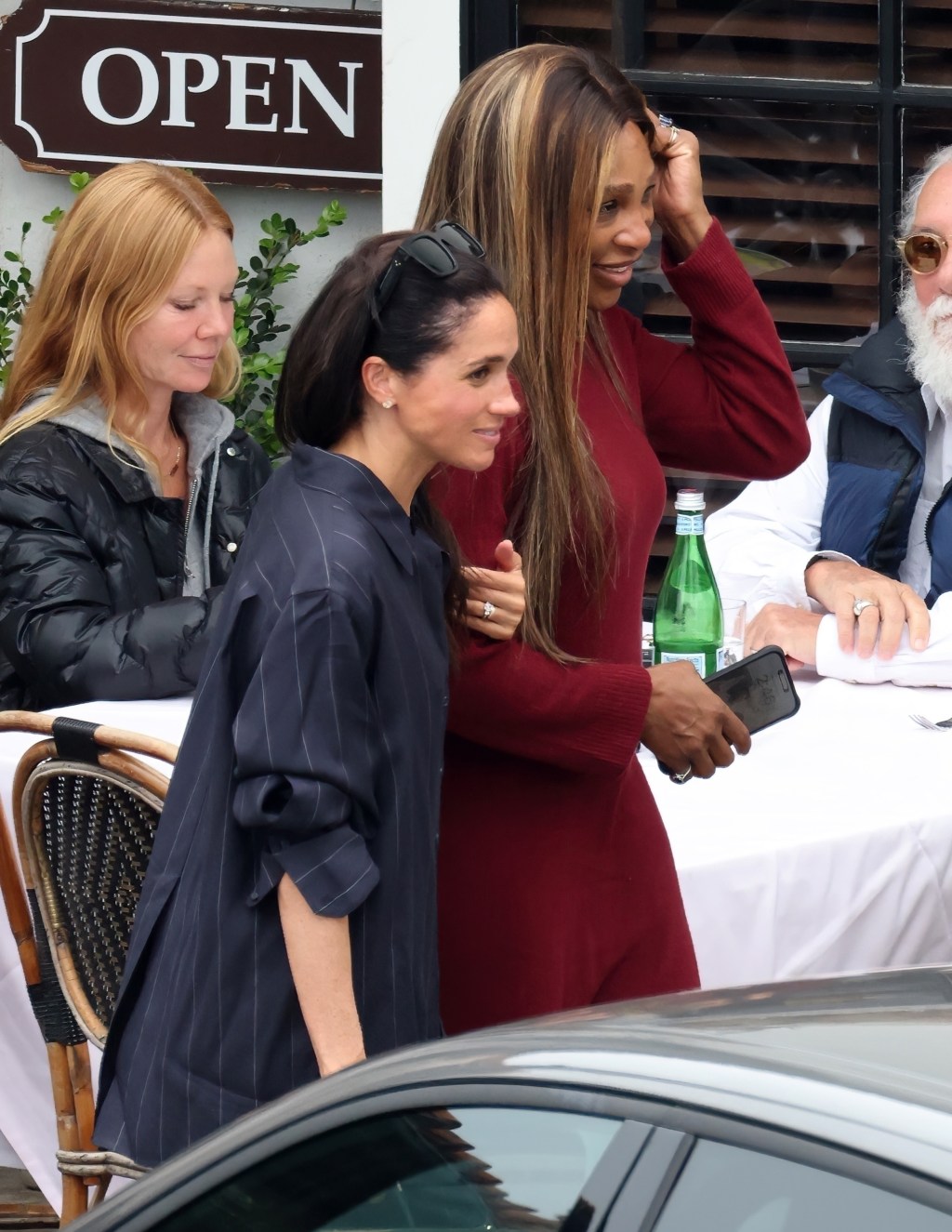 Meghan Markle links arms with Serena Williams as they grab lunch in