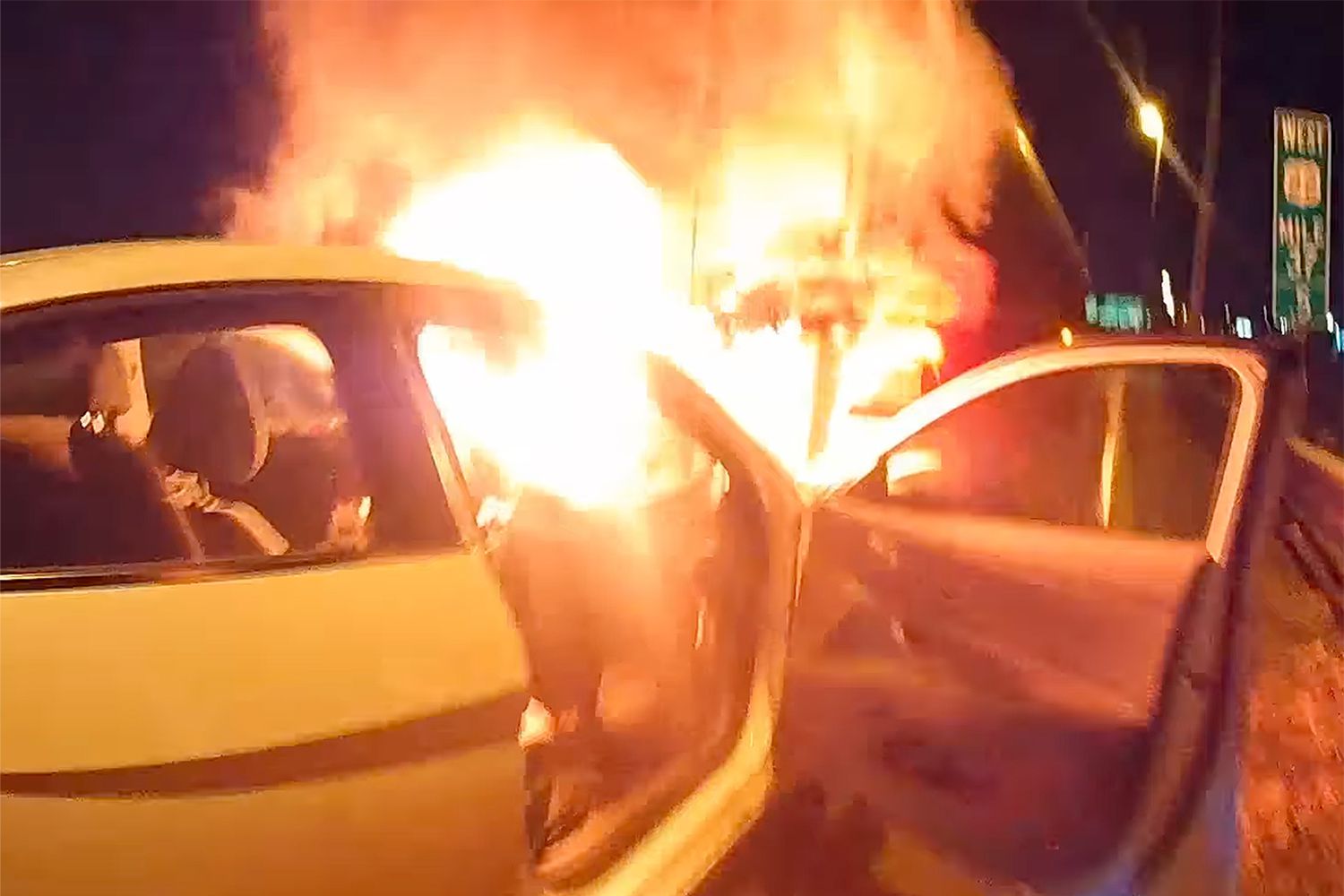 Police Officer Rescues Trapped, Unconscious Man from Burning Car Wreck