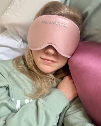 Person relaxing with a sleep mask labeled