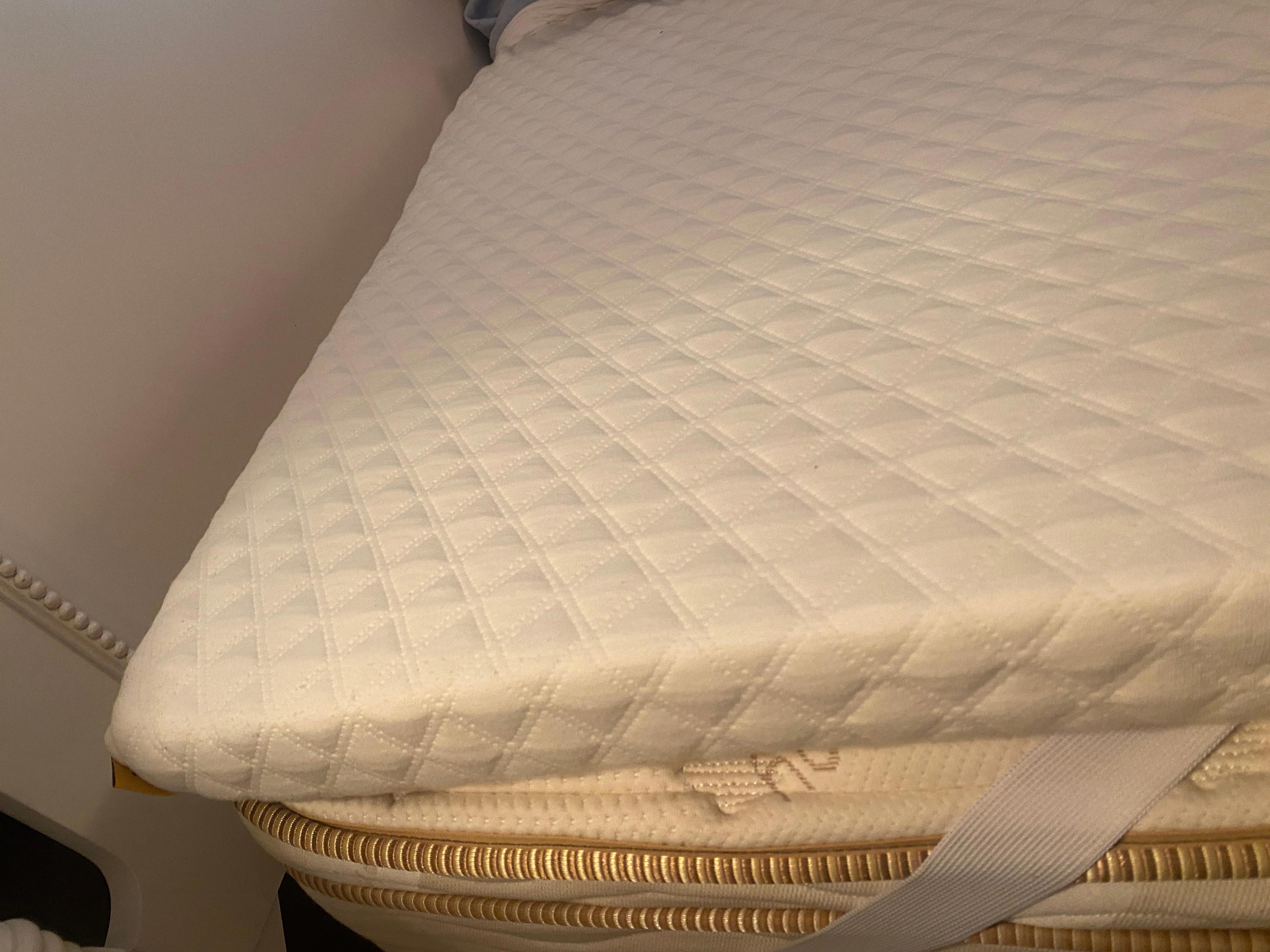nolah mattress topper on a bed