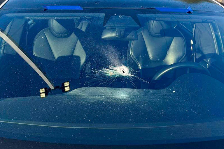 A vehicle with a damaged windscreen outside of a Tesla dealership on Thursday in Tigard. Ore.