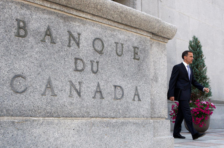 Carney leaves his office for a news conference in Ottawa in 2008.