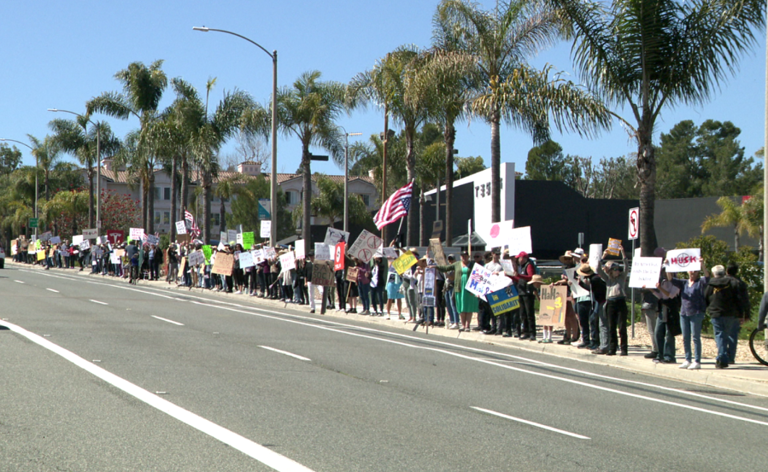 Protesters rally outside Tesla dealership in San Diego County