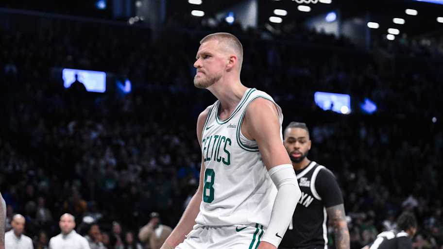 Mar 15, 2025; Brooklyn, New York, USA; Boston Celtics center Kristaps Porzingis (8) reacts after dunking the ball against the Brooklyn Nets during the second half at Barclays Center. Mandatory Credit: John Jones-Imagn Images | John Jones-Imagn Images