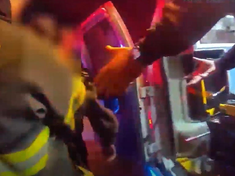 Video captures woman’s reaction as firefighters rescue stepson(02)