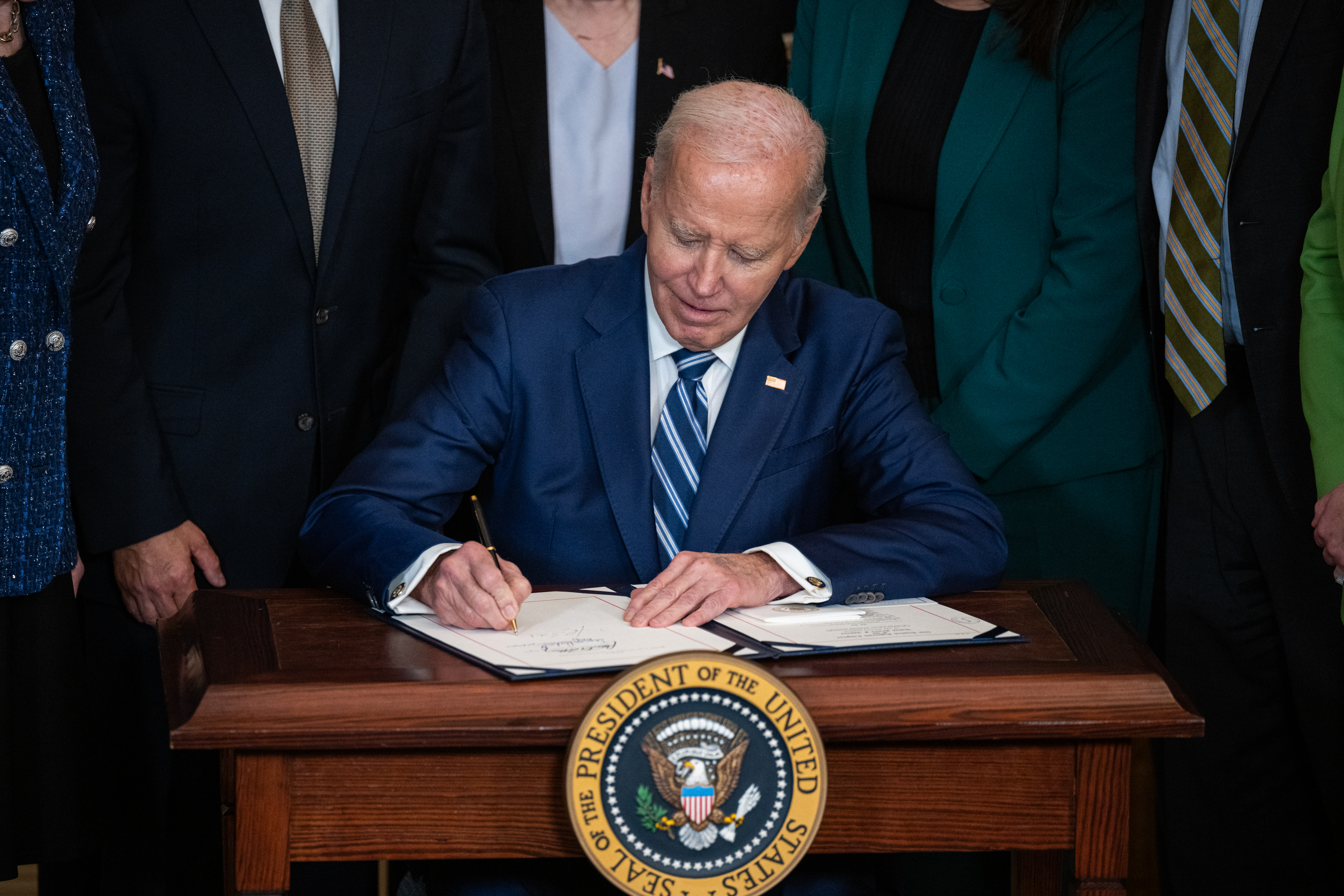 President Joe Biden signs the Social Security Fairness Act in the East Room of the White House on Jan. 5.