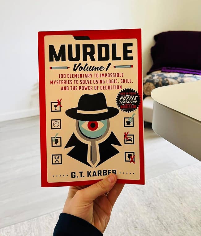 Person holding the book