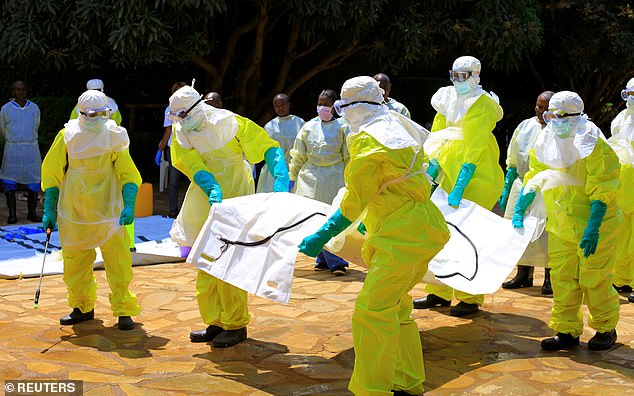 2018: Congolese officials and the World Health Organisation officials wear protective suits as they participate in a training against the Ebola virus near the town of Beni in North Kivu province of the Democratic Republic of Congo
