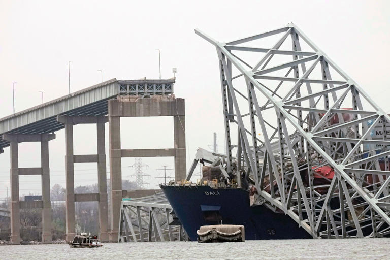 A cargo ship, now removed, pictured under the remains of the Francis Scott Key Bridge after causing its destruction in 2024 (Copyright 2024 The Associated Press. All rights reserved)