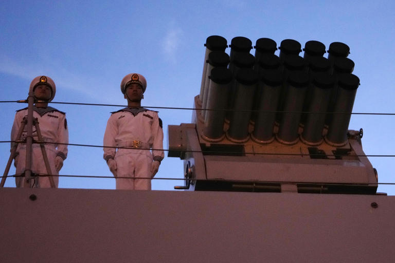 Chinese navy troops attending a joint naval drill with Iran and Russia stand on the deck of their warship in an official arrival ceremony at Shahid Beheshti port in Chabahar in the Gulf of Oman, Iran, Tuesday, March 11, 2025. Vahid Salemi/AP Photo