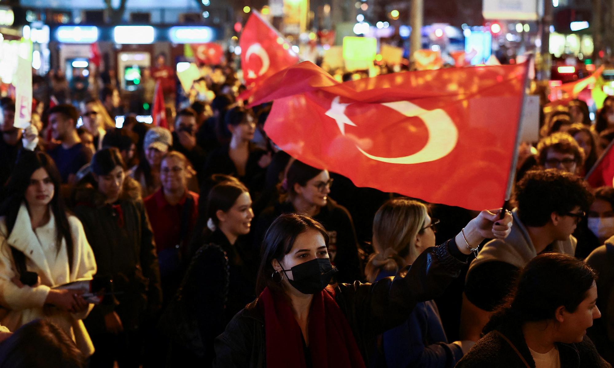 A woman holding a Turkish flag during a protest against the arrest of Ekrem İmamoğlu, Istanbul, 26 March 2025. Photograph: Emilie Madi/Reuters