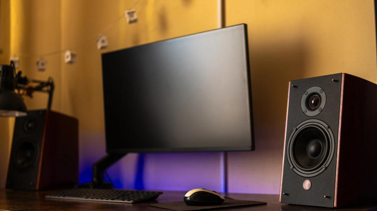 Desktop with large monitor and speakers