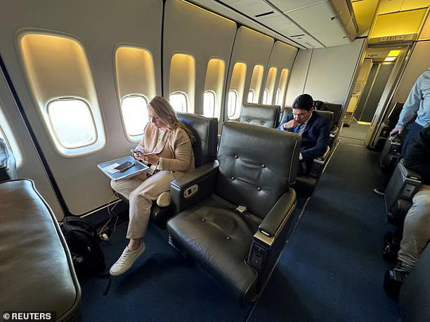 Two empty seats that traditionally would have been reserved for the Associated Press reporter and photographer are shown in the press cabin of Air Force One during a flight last month