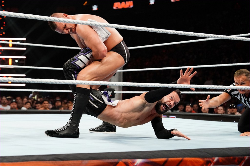 Finn Balor reaches for the ropes as GUNTHER attempts to hold him in a Boston crab during last week's WWE's Monday Night RAW.