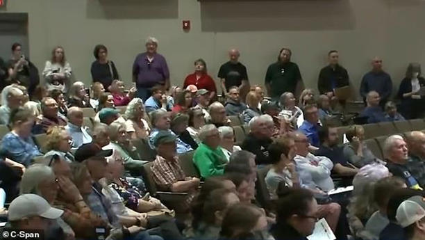 Flood's town hall in a high school auditorium was attended by roughly 200 people