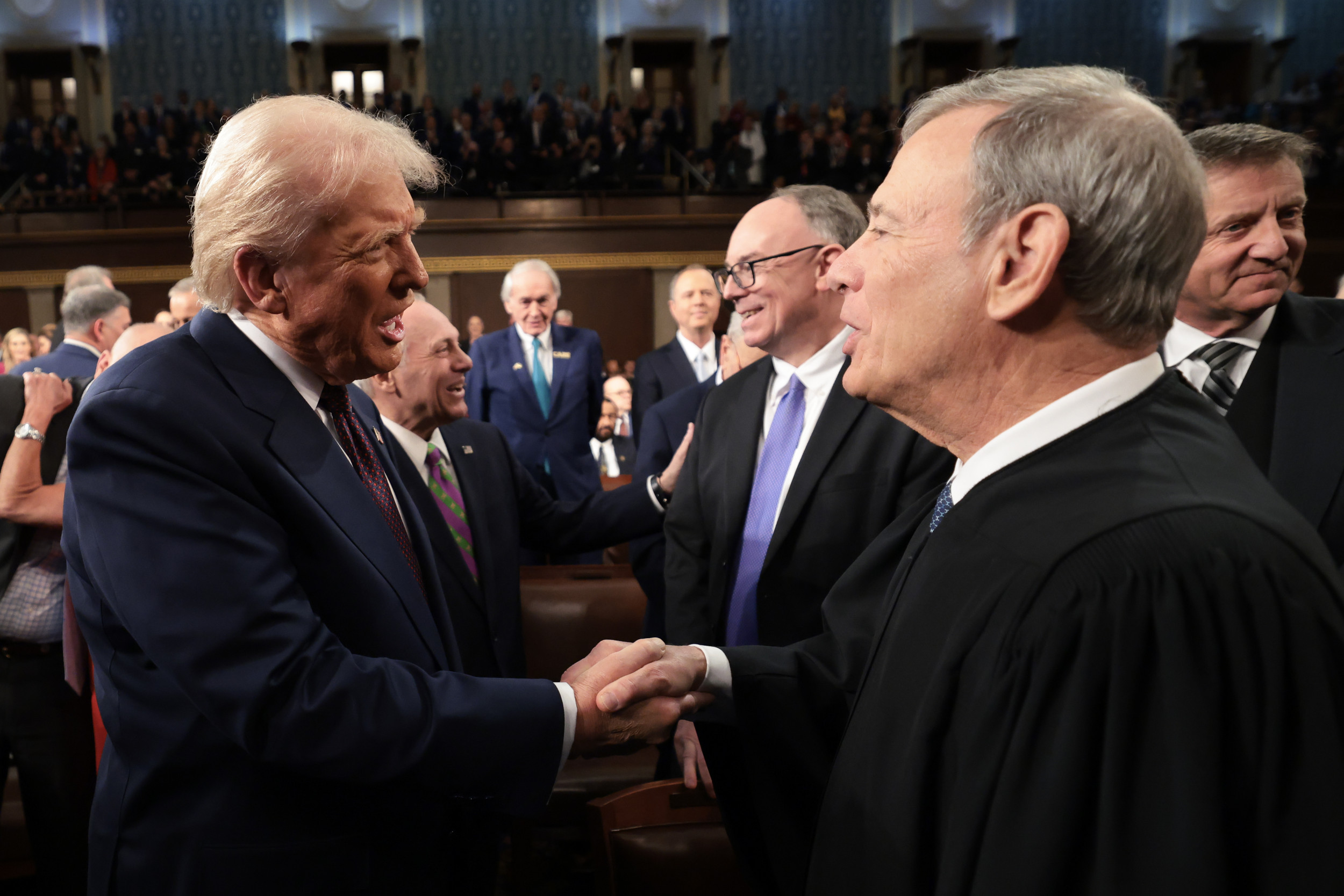U.S. President Donald Trump (L) greets Chief Justice of the United States John G. Roberts, Jr as he arrives to deliver an address to a joint session of Congress at the U.S. Capitol on March 04, 2025, in Washington, DC. AFP/Getty Images