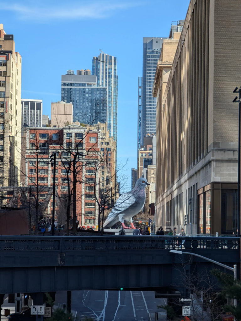 "This picture makes it look fake, but that pigeon statue is real and it's amazing. Sits on the High Line near Chelsea." — u/amalgamate_ u/killbeam / reddit.com