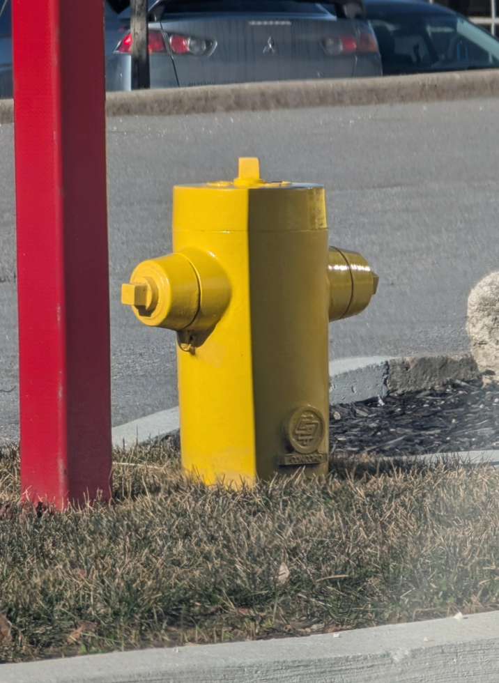 The shadow that is casting on it from the red pole makes it look square but it is just a regular cylinder-shaped hydrant! u/Nillows / reddit.com