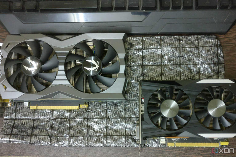 GTX 1660 Ti and GTX 1050 Ti graphics cards on a desk