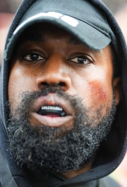 Kanye West sparks outrage with KKK-inspired outfit and swastika necklace