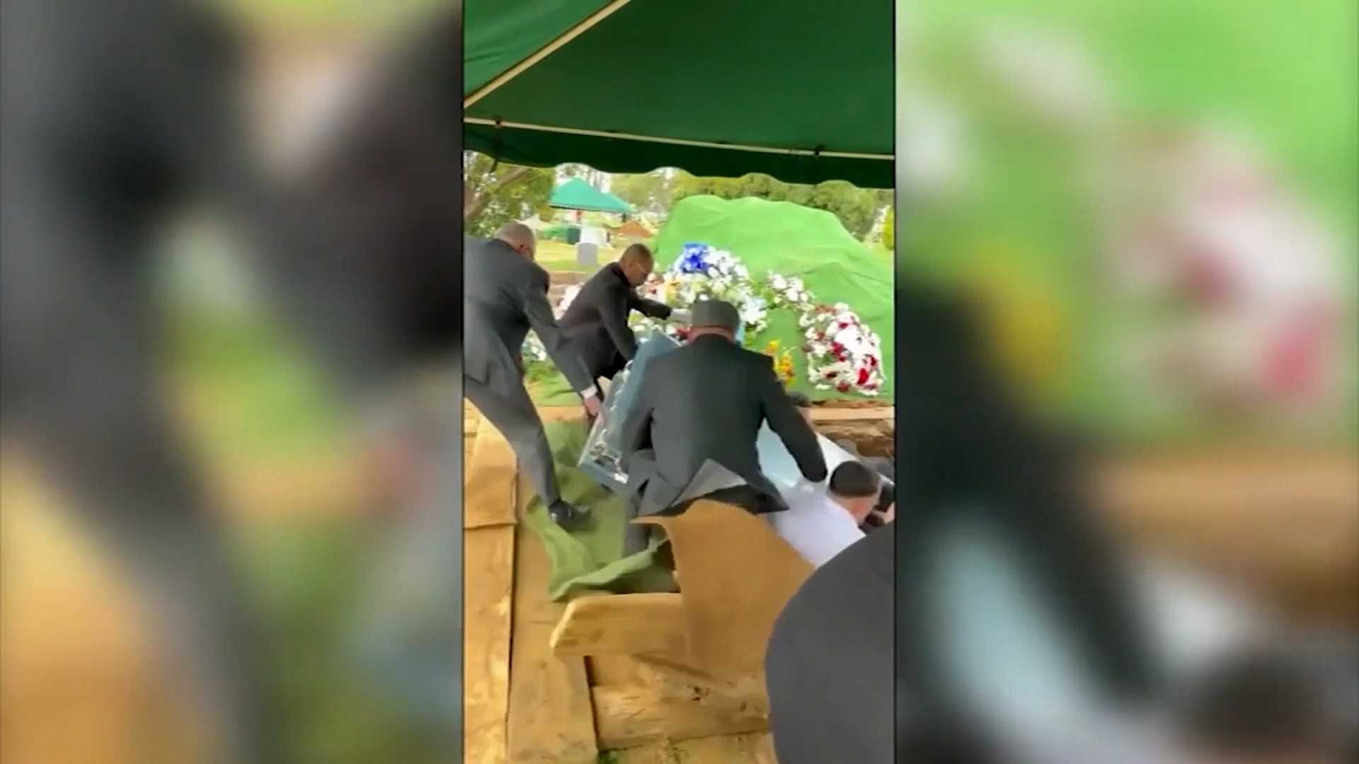 Shocking video shows pallbearers and casket falling into grave in