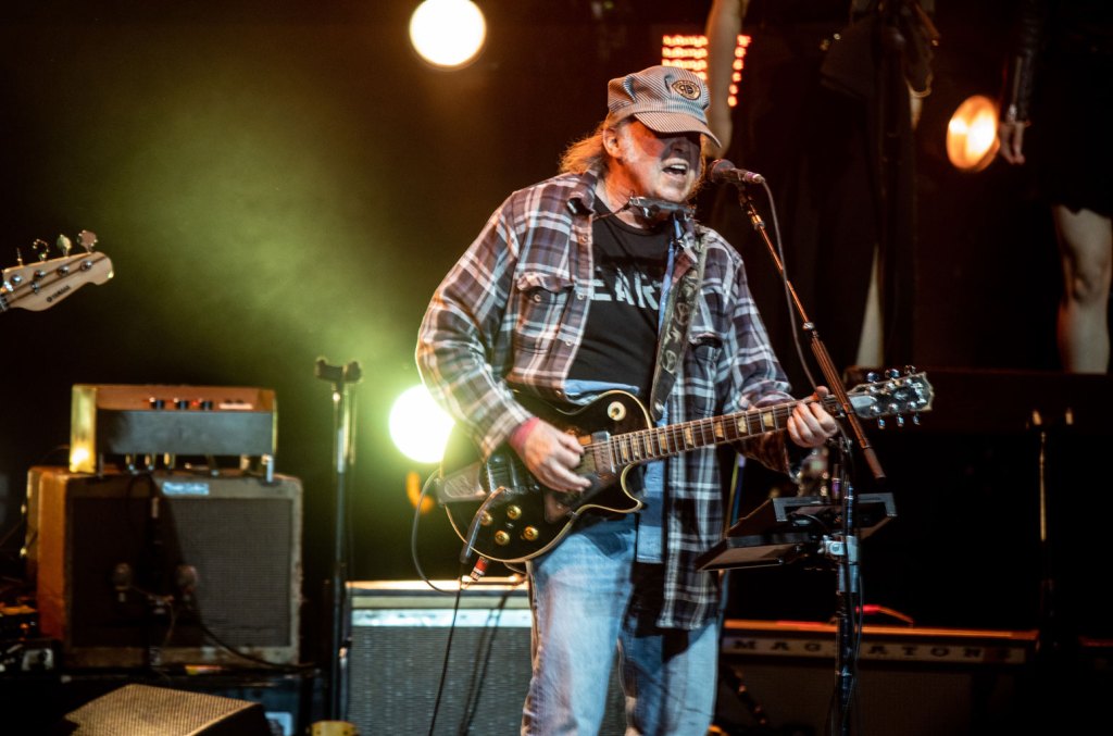 Neil Young, Joan Baez & Maggie Rogers Perform at ‘Fighting Oligarchy' Rally