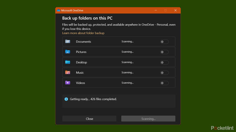 Scanning and selecting Windows 11 folders for OneDrive sync.