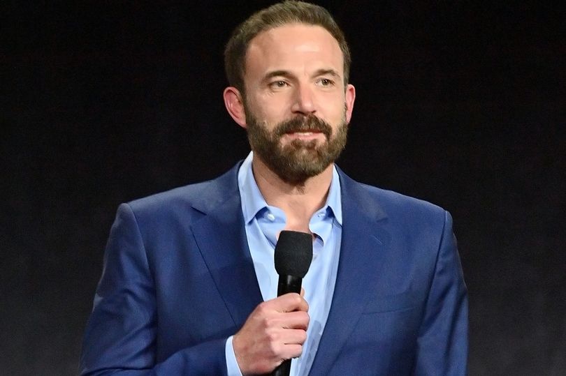 Ben Affleck shows off his sense of humor as he poses next to his own