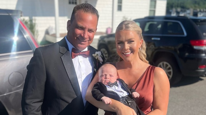 Karoline Leavitt and Nicholas Riccio pose with their son