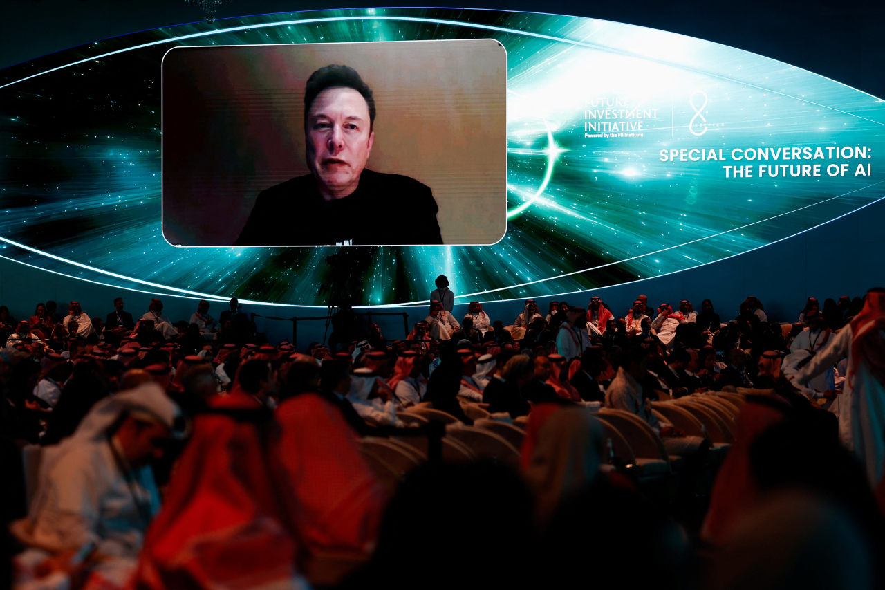 Musk on screen at an investment conference in Saudi Arabia in 2024.