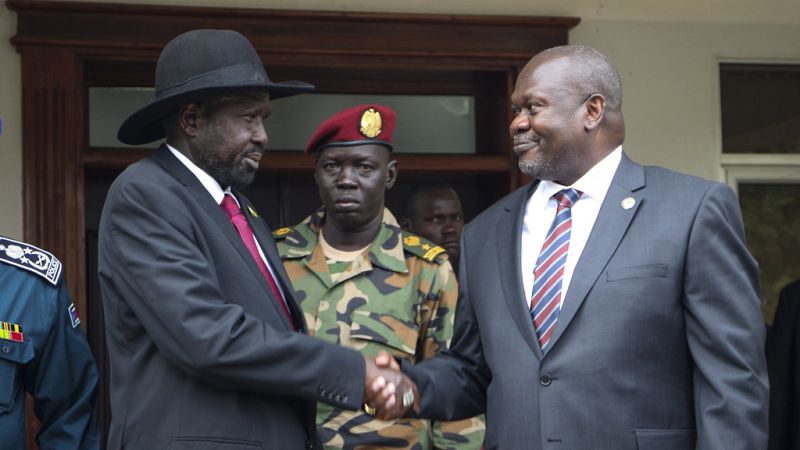 South Sudan's president Salva Kiir, left, and vice-president Riek Machar, right, shake hands after meetings to discuss outstanding issues to the peace deal on Oct. 20, 2019.