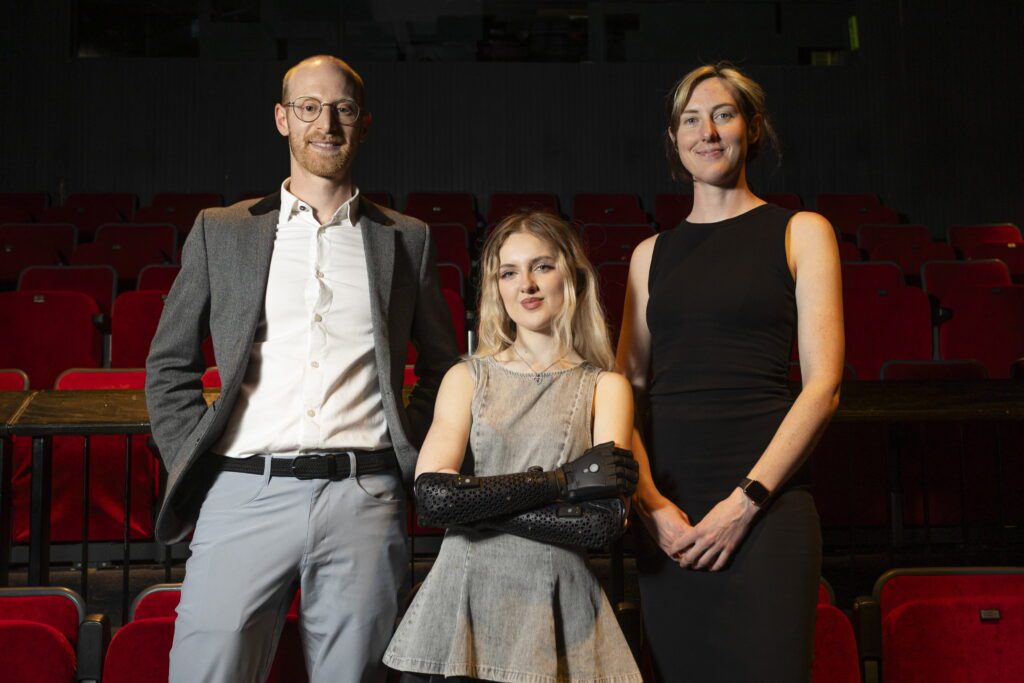 Tilly (centre) with Open Bionics CEOs Joel Gibbard and Samantha Payne. (Pix via SWNS)