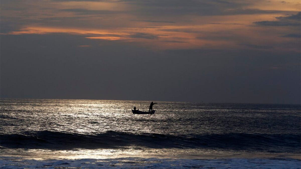 An Indian fisherman returns at sunset after fishing in the Arabian Sea in Thiruvananthapuram. AP