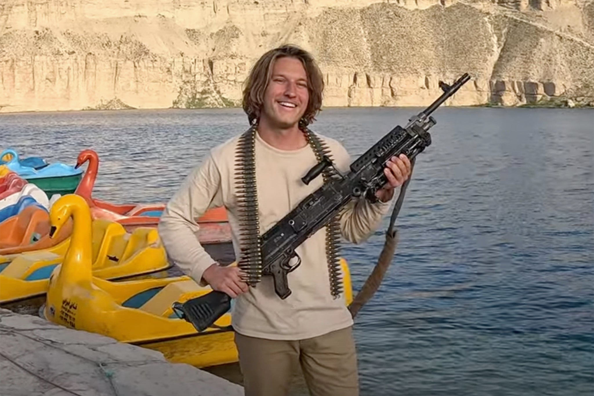 Mykhailo Polyakov poses with a gun during a visit to Afghanistan (Youtube/Neo-Orientalist)
