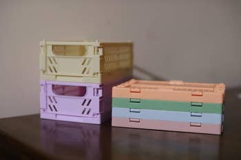 Stacked collapsible storage crates on a table